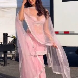 baby pink organza embroidered sharara set🌷 product description – baby pink organza sharara set step into elegance with this baby pink organza sharara set, a timeless blend of grace, softness, and style. crafted from premium organza fabric, this outfit drapes beautifully, giving you a dreamy and royal look. the delicate baby pink hue exudes femininity and charm, making it perfect for festive occasions and special celebrations. the ensemble features a sleeveless kurta paired with a flowing sharara and a sheer dupatta adorned with intricate lace borders and subtle pearl detailing. every element of this outfit is designed to make you feel light, confident, and effortlessly graceful. whether it’s a wedding, engagement, festival, or party, this outfit ensures all eyes are on you. pair it with minimal jewelry and soft curls for a radiant, ethereal appearance. ✨ key features: color: baby pink fabric: lightweight organza style: sharara set with dupatta occasion: weddings, festivals, parties, or special events look: elegant, feminine, and comfortable the baby pink organza sharara set is not just a dress — it’s an experience of grace and beauty, designed to make you feel like a vision of serenity and sophistication.